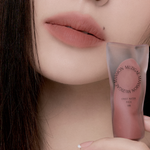 Muzigae Mansion Objet Water Lip Tint Pitch applied on lips, showing translucent, hydrated finish