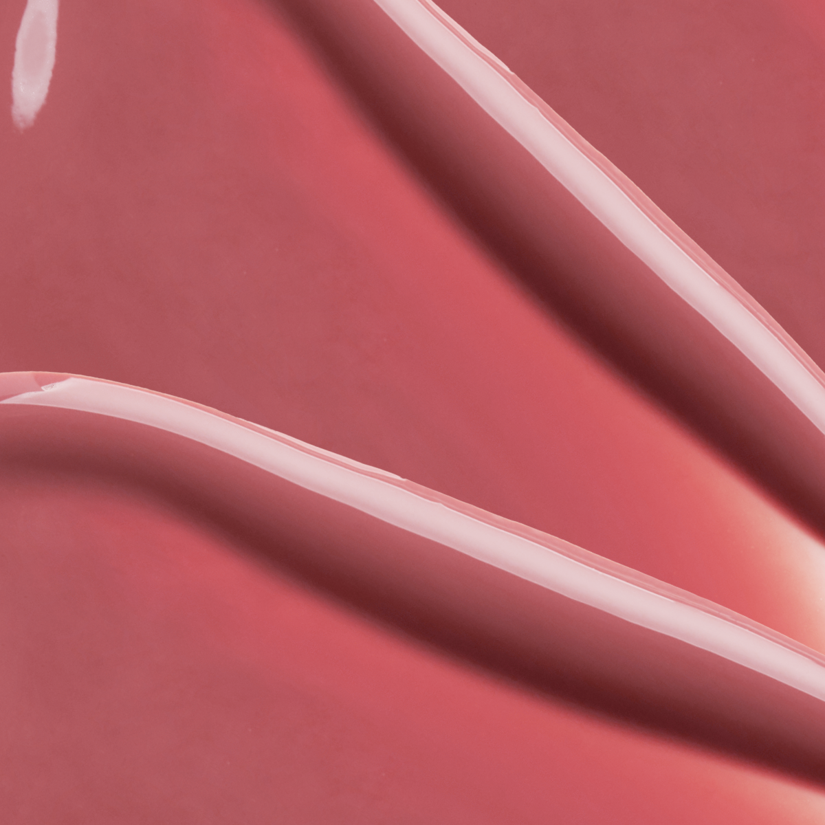Close-up texture swatch of Muzigae Mansion Objet Water Lip Tint in Pitch, showcasing its watery, smooth finish