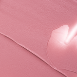 Close-up texture swatch of Muziage Mansion Objet Liquid Lip Tint in Dawn Rose 023, showcasing its smooth matte finish