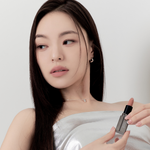 Model wearing Muzigae Mansion Moodwear Blur Semi-Matte Lipstick in 004 Layered, demonstrating the shade in natural lighting