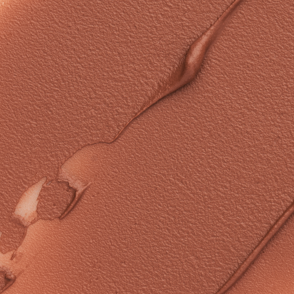 Close-up texture swatch of Muziage Mansion Objet Liquid Lip Tint in Pride 015, showcasing its smooth matte finish
