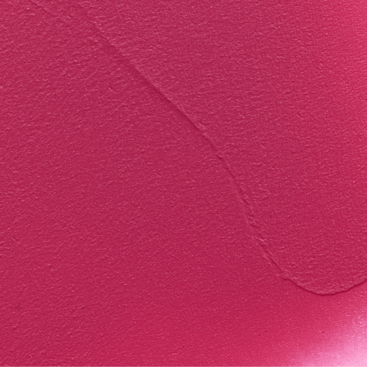 Close-up texture swatch of Muziage Mansion Objet Liquid Lip Tint in Knockout 018, showcasing its smooth matte finish
