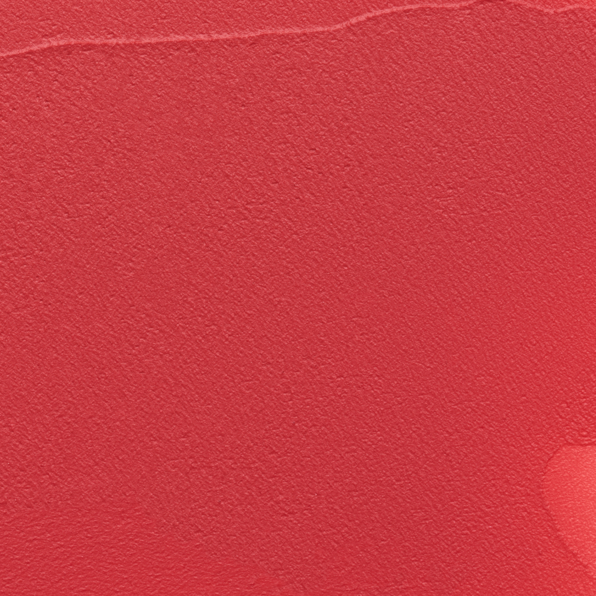 Close-up texture swatch of Muziage Mansion Objet Liquid Lip Tint in Pleasure 020, showcasing its smooth matte finish