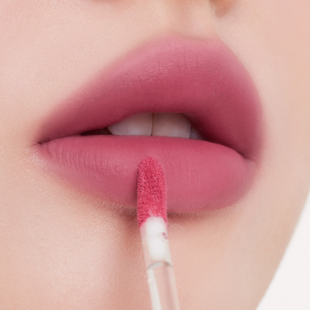 Muziage Mansion Objet Liquid Lip Tint in Gypsy Rose 024 applied on lips, showing smooth matte finish