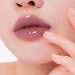 Muzigae Mansion Icy Glow Lip Gloss 09 Chill applied on lips, showing sheer, radiant shine